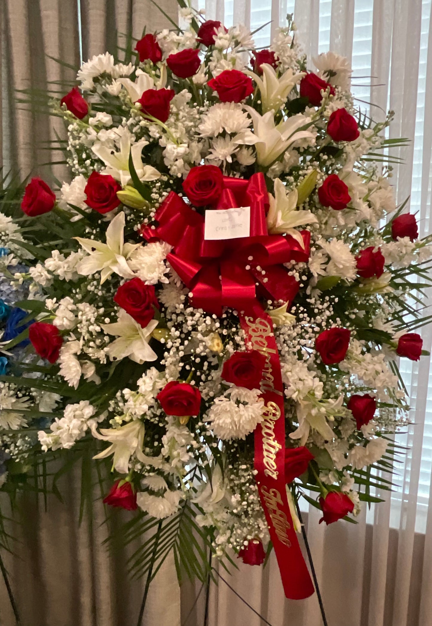 Red and white standing spray – Pequa Park Florists Inc, Massapequa NY