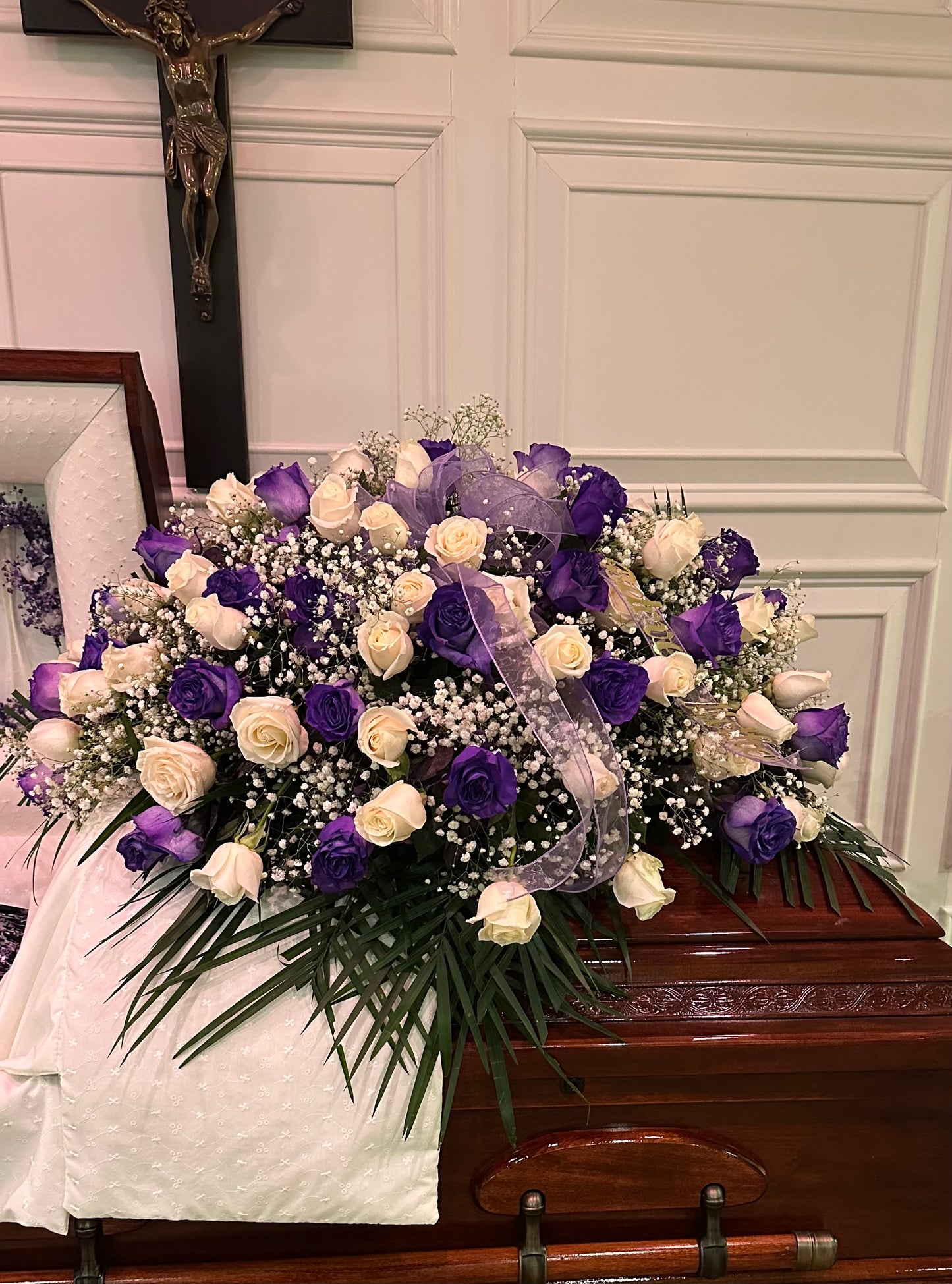 Purple and white rose blanket for the casket – Pequa Park Florists Inc, Massapequa NY
