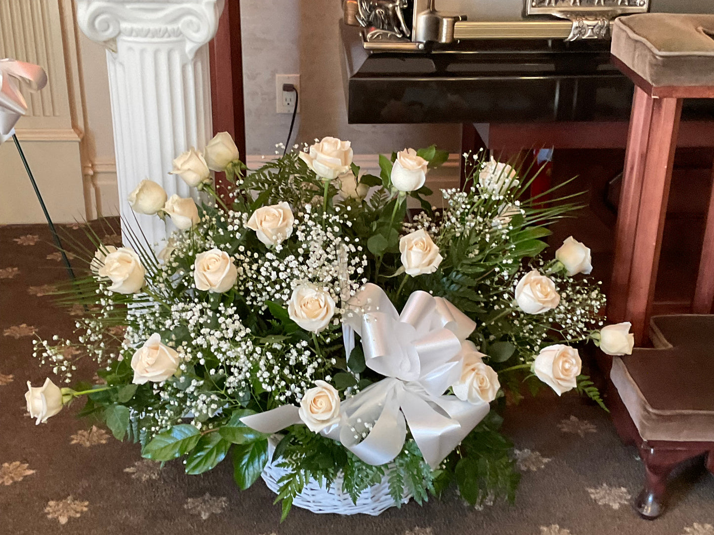 Pequa White roses in a wicker basket – Pequa Park Florists Inc, Massapequa NY