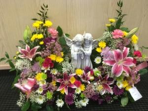 Angel in flowers – Pequa Park Florists Inc, Massapequa NY